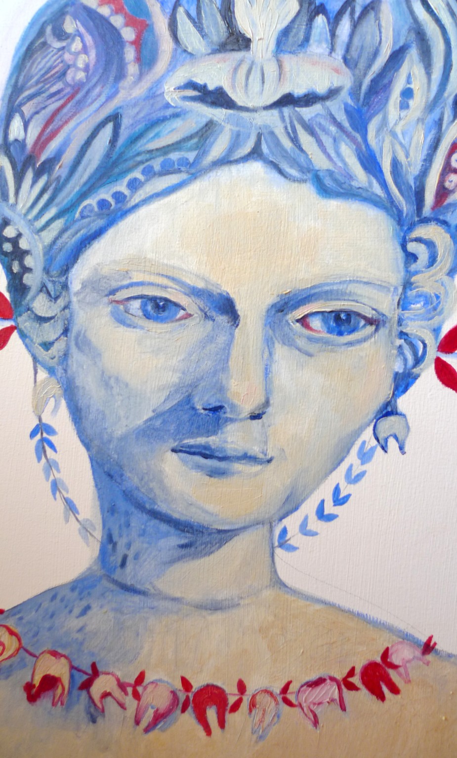 A blue female face with organic forms on her head and red flowers at her neck.